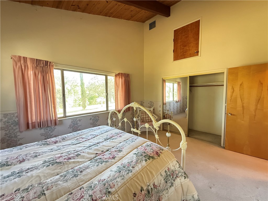 4952 Hidden Springs Road Mariposa, CA 95338 - Photo 35 of 53 a bedroom with a bed and a large window