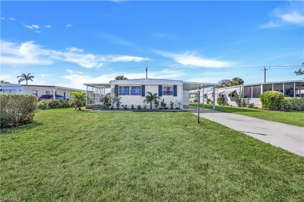 a view of a patio with table and chairs and potted plants