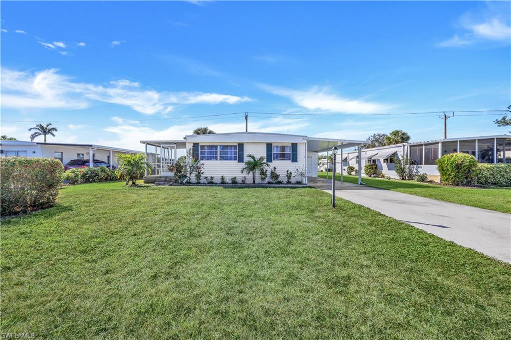 a view of a patio with table and chairs and potted plants