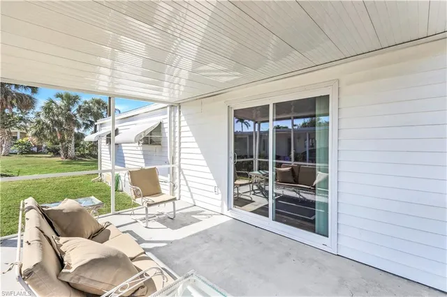 a view of backyard with furniture and garden