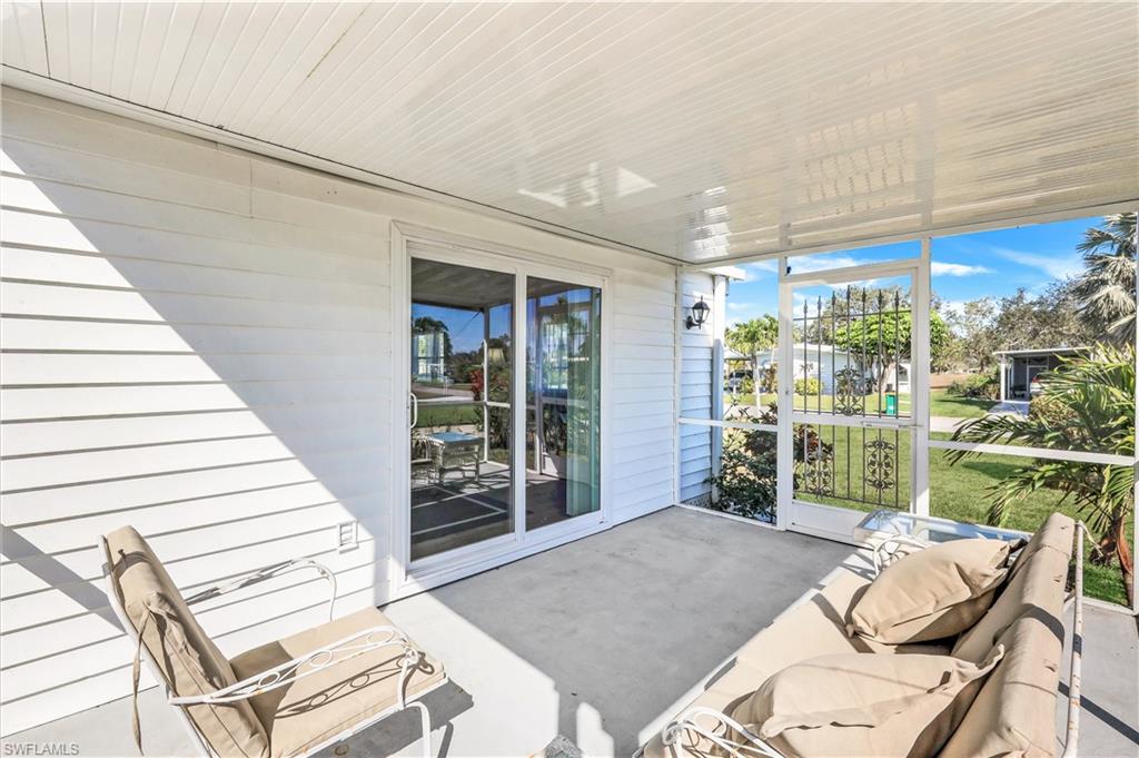 21 Lemans Drive Naples, FL 34112 - Photo 21 of 26 a bedroom with a bed and a window