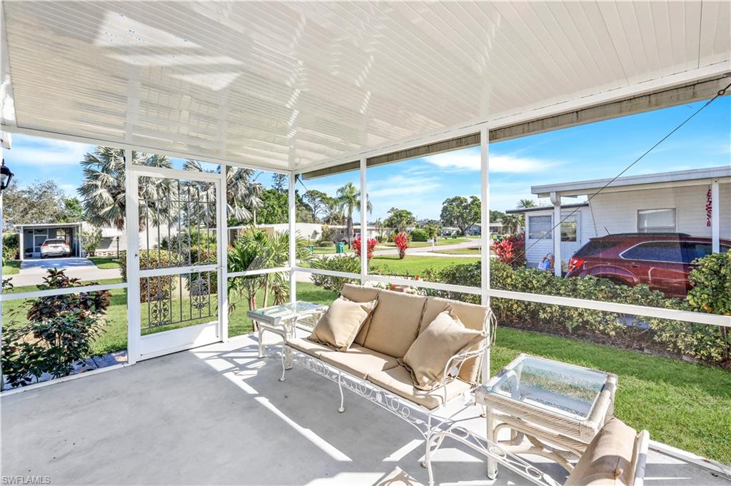 21 Lemans Drive Naples, FL 34112 - Photo 22 of 26 a view of yard from deck with patio