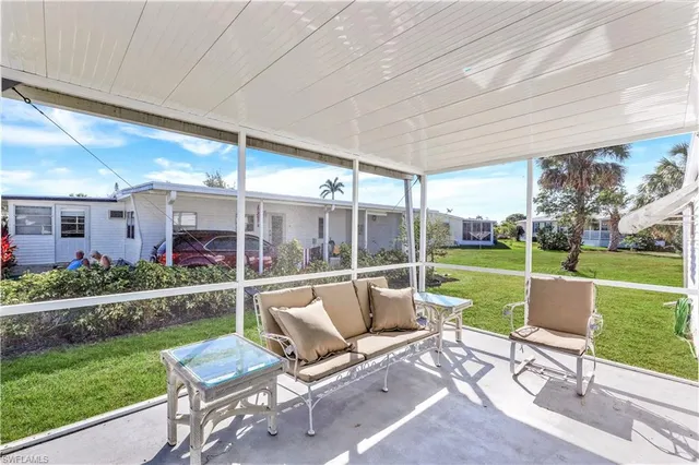 a view of swimming pool with a table and chairs