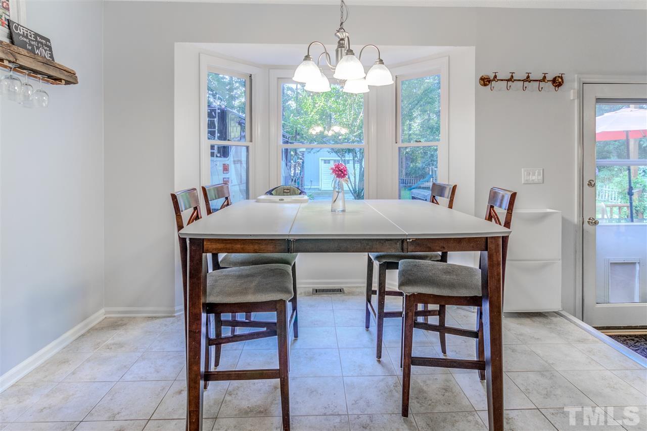 2724 Quail Point Drive Raleigh, NC 27603 - Photo 11 of 25 a view of a dining room with furniture window and outside view