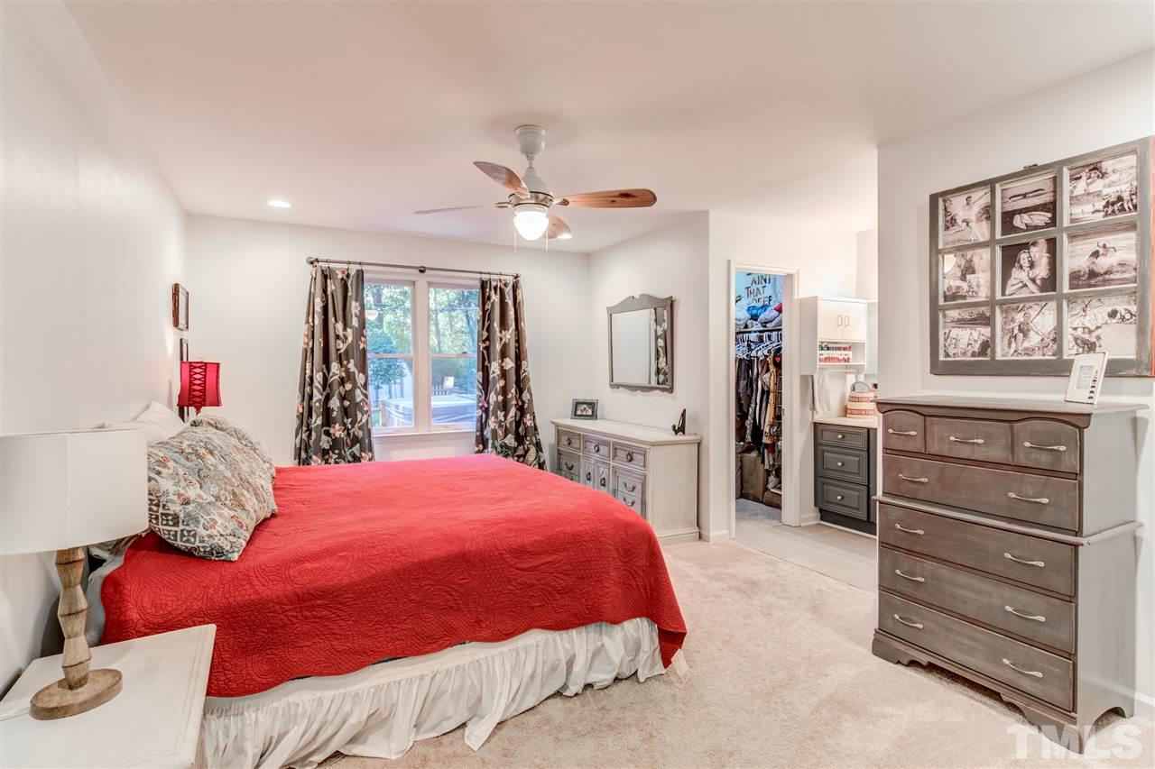 2724 Quail Point Drive Raleigh, NC 27603 - Photo 14 of 25 a bedroom with a bed and a dresser