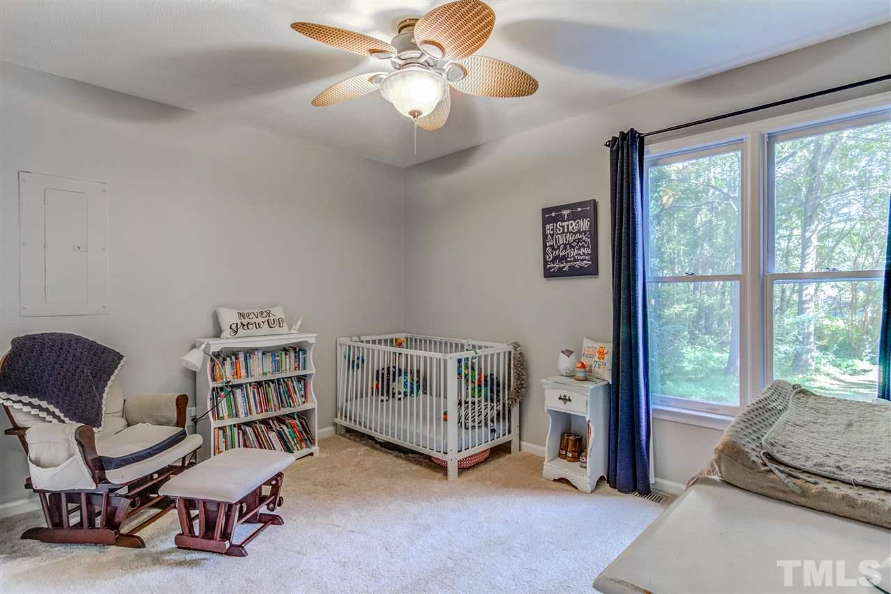 2724 Quail Point Drive Raleigh, NC 27603 - Photo 19 of 25 a living room with furniture and a window