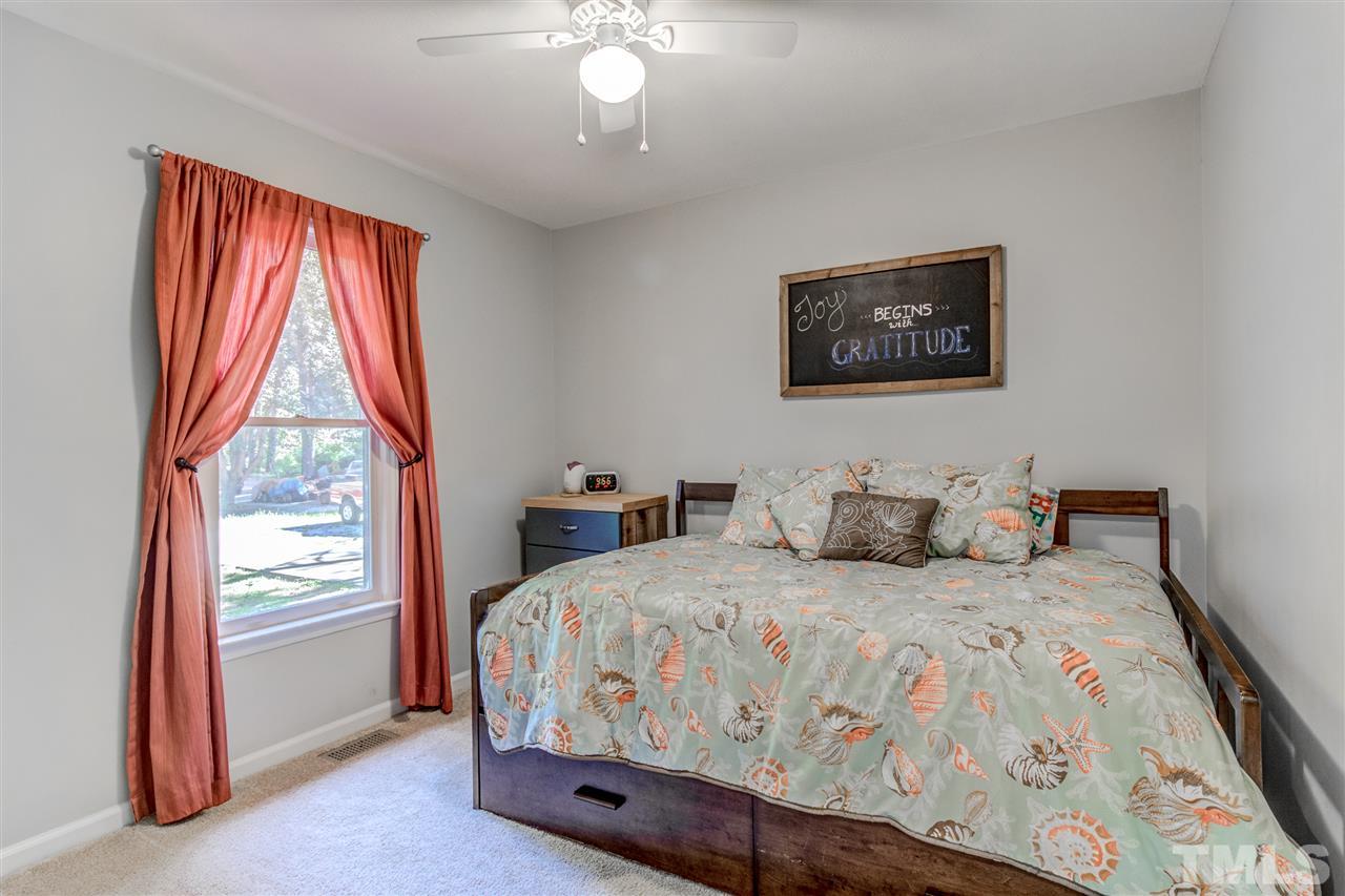 2724 Quail Point Drive Raleigh, NC 27603 - Photo 20 of 25 a bedroom with a bed and a window