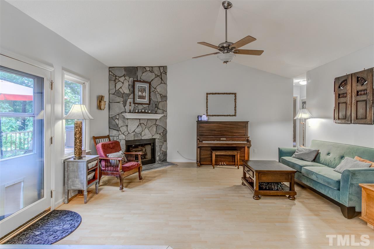 2724 Quail Point Drive Raleigh, NC 27603 - Photo 5 of 25 a living room with furniture and a fireplace