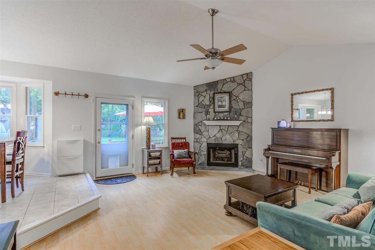2724 Quail Point Drive Raleigh, NC 27603 - Photo 6 of 25 a living room with furniture and a fireplace