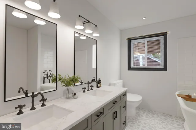 a bathroom with a double vanity sink and a mirror