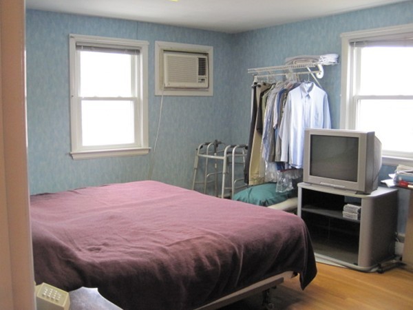 15 Tilden Road Canton, MA 02021 - Photo 13 of 23 a bedroom with a bed and a flat tv screen