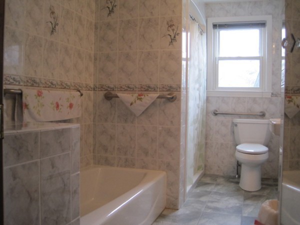 15 Tilden Road Canton, MA 02021 - Photo 10 of 23 a bath room with a toilet and a shower