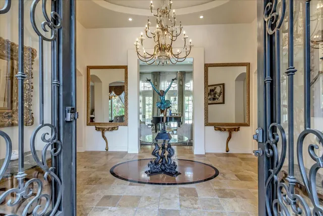 a view of a livingroom with furniture and a chandelier
