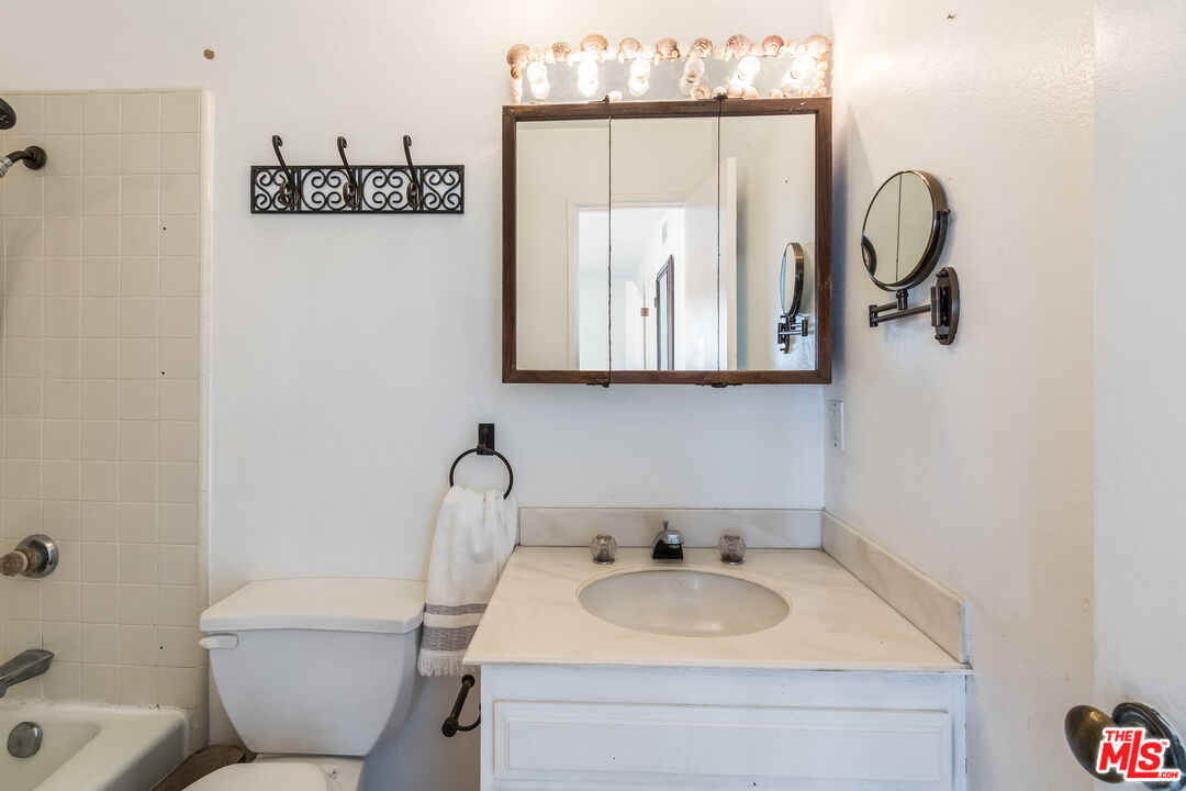 25 Hurricane Street, Unit 3 Marina del Rey, CA 90292 - Photo 11 of 27 a bathroom with a toilet sink and mirror