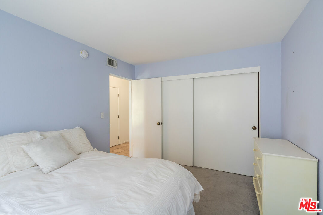 25 Hurricane Street, Unit 3 Marina del Rey, CA 90292 - Photo 14 of 27 a bedroom with a bed and a window