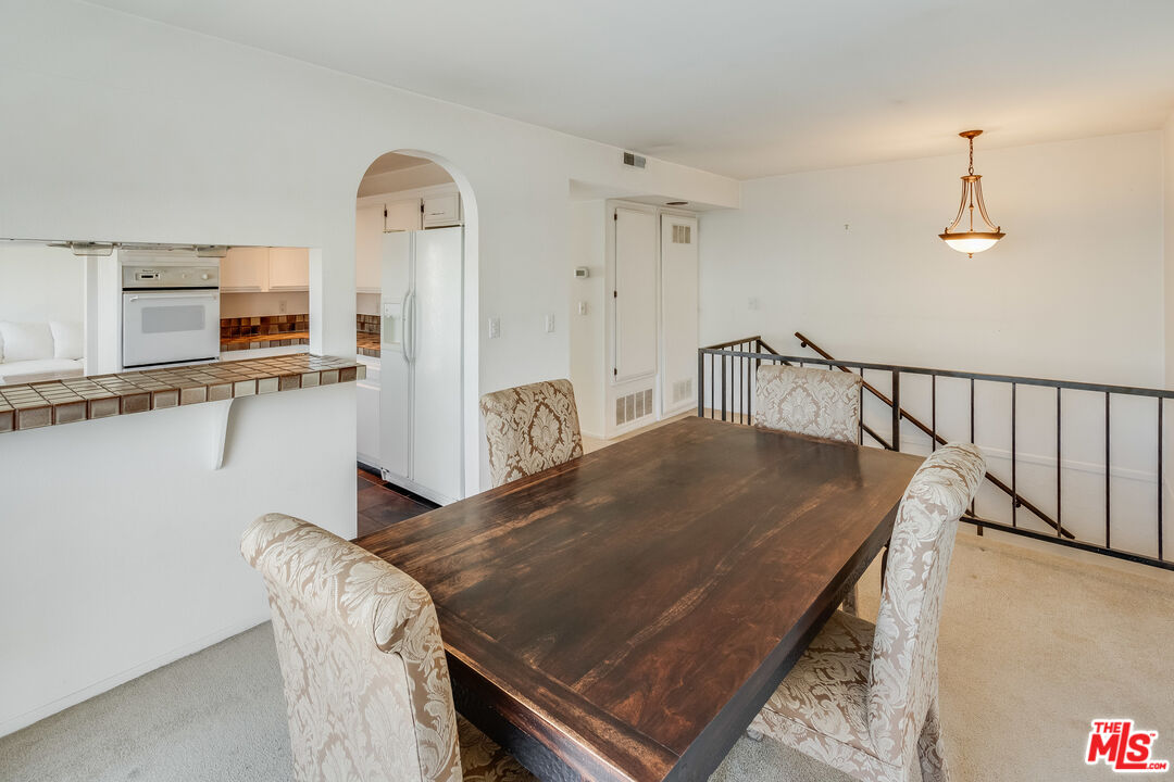 25 Hurricane Street, Unit 3 Marina del Rey, CA 90292 - Photo 17 of 27 a dining room with furniture and a table