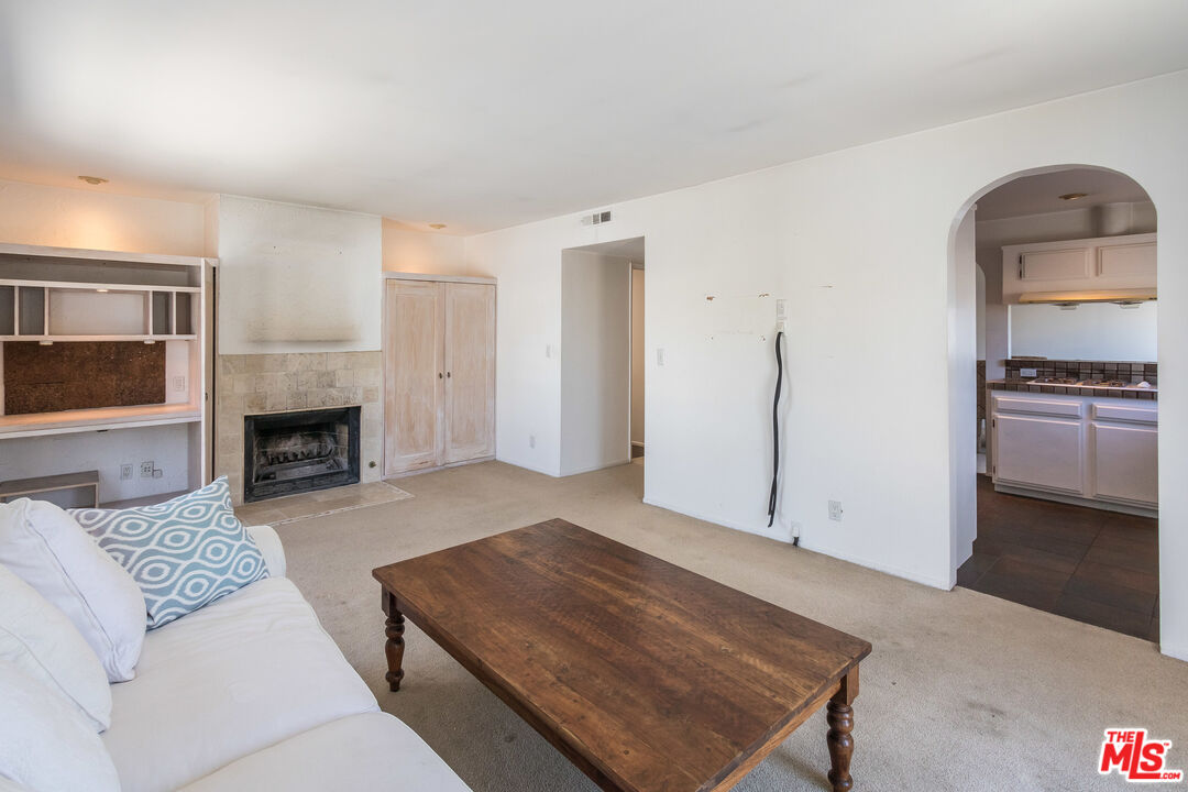 25 Hurricane Street, Unit 3 Marina del Rey, CA 90292 - Photo 22 of 27 a living room with furniture and a fireplace