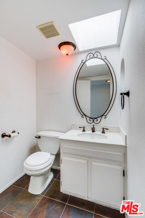 25 Hurricane Street, Unit 3 Marina del Rey, CA 90292 - Photo 25 of 27 a bathroom with a toilet a sink and mirror