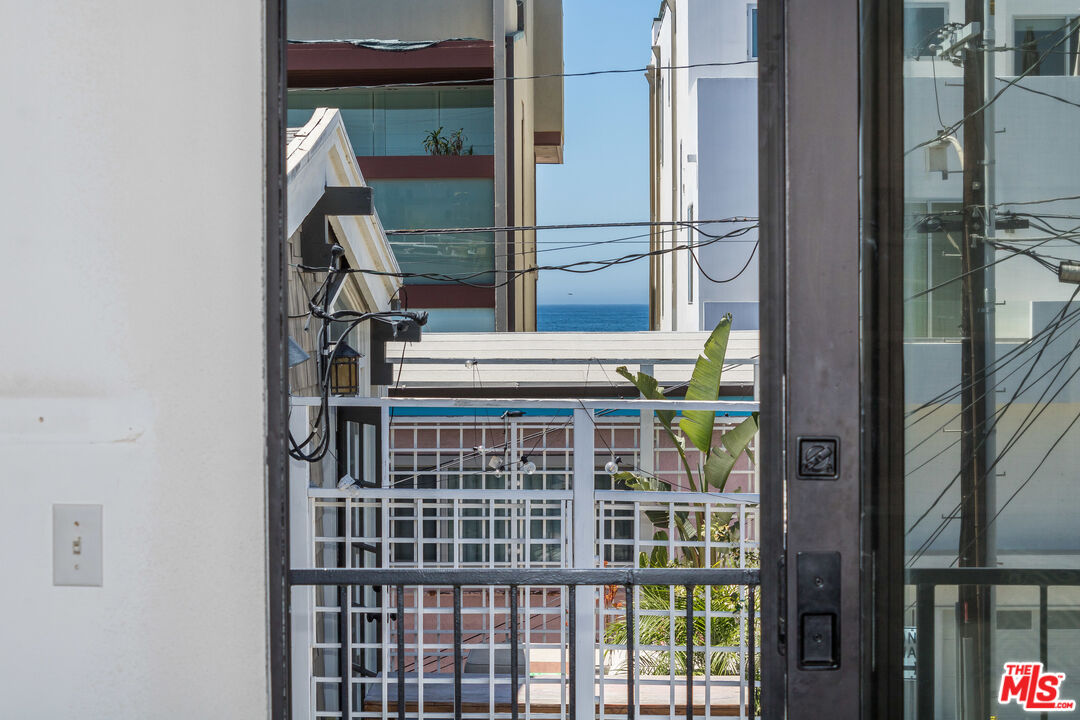 25 Hurricane Street, Unit 3 Marina del Rey, CA 90292 - Photo 26 of 27 a view of staircase with white walls and a window