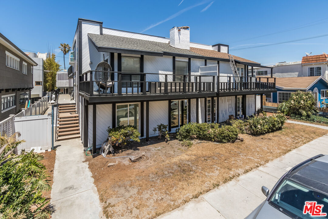 25 Hurricane Street, Unit 3 Marina del Rey, CA 90292 - Photo 5 of 27 a front view of a house with a yard
