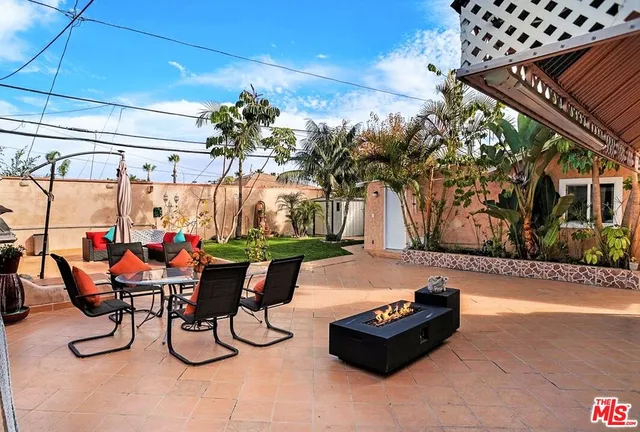 a view of a chairs and tables in the patio