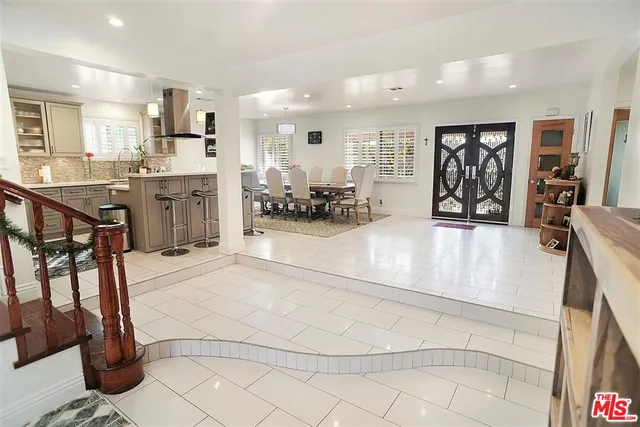 a view of a living room kitchen and a sink