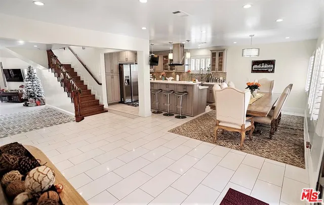 a living room with kitchen island furniture and a wooden floor