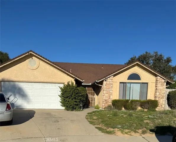 a view of a house with a small yard