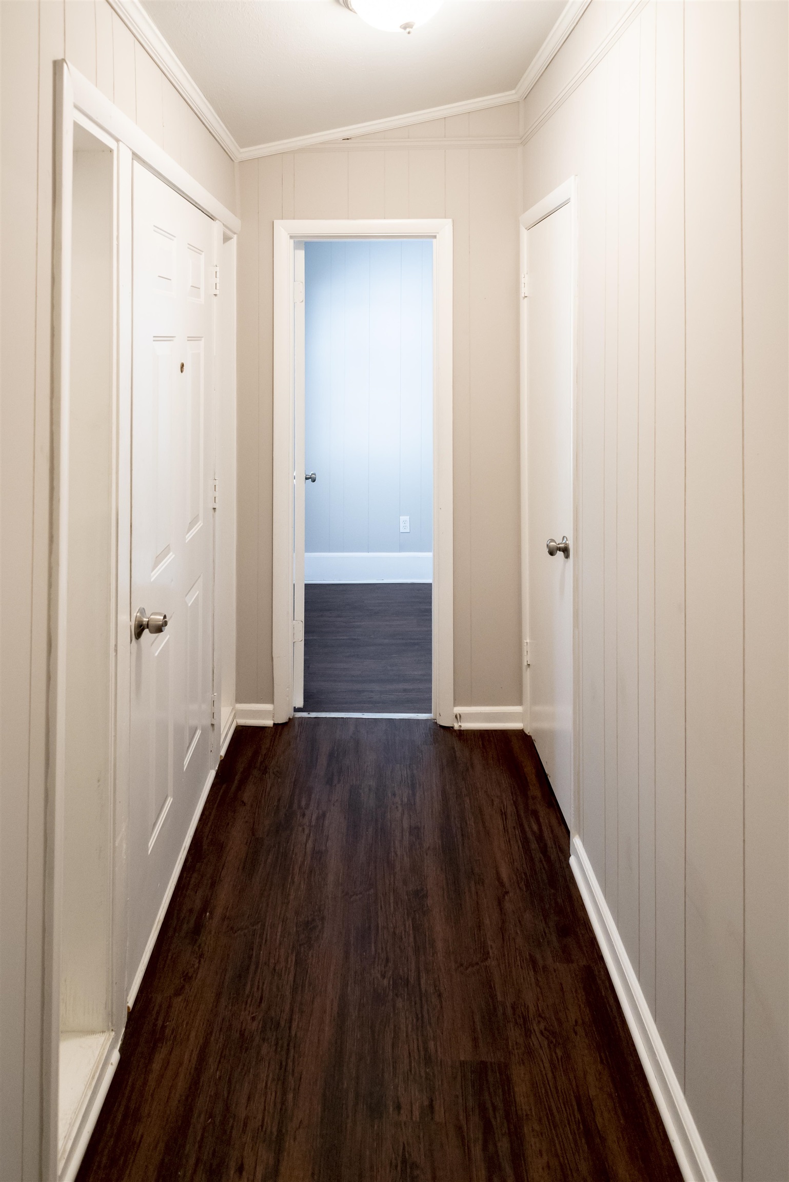 4622 Applegate Road Memphis, TN 38109 - Photo 11 of 13 a view of an empty room with wooden floor