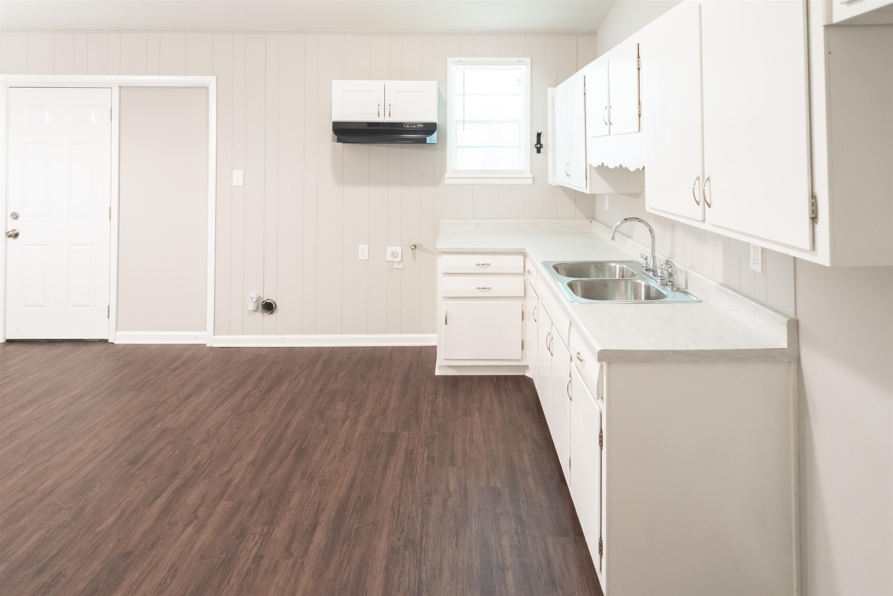 4622 Applegate Road Memphis, TN 38109 - Photo 7 of 13 a kitchen with a sink a stove and cabinets