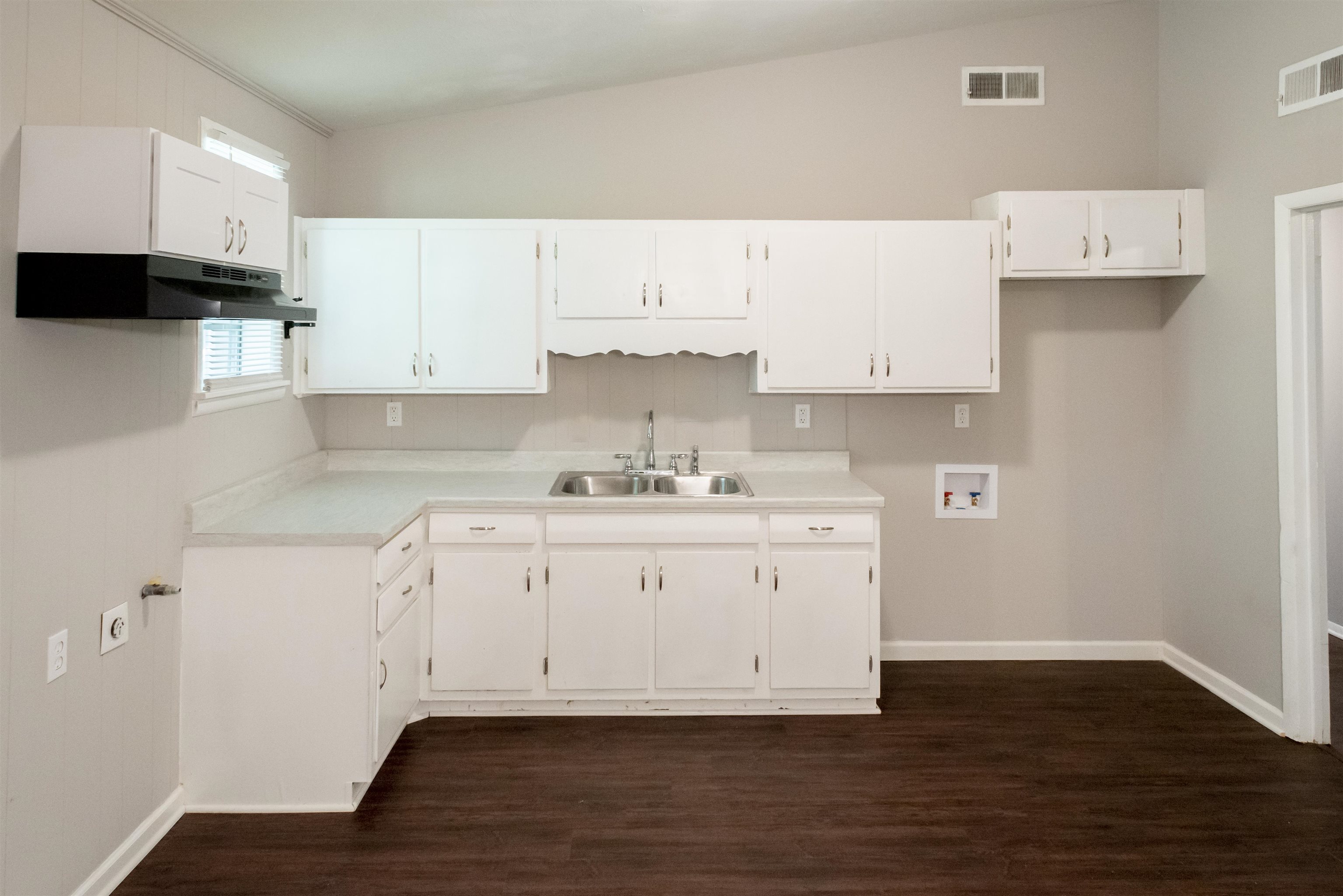 4622 Applegate Road Memphis, TN 38109 - Photo 8 of 13 a view of cabinets with wooden floor