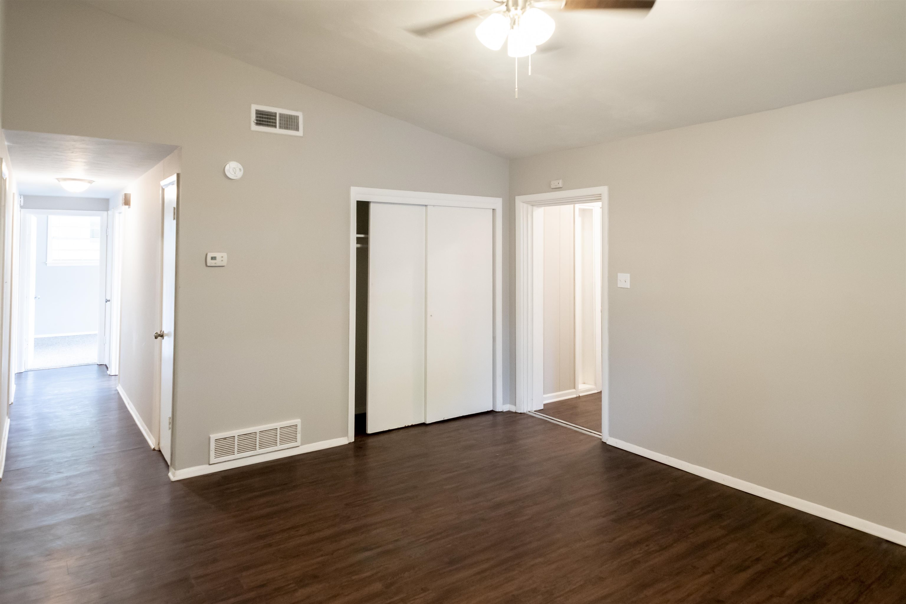 4622 Applegate Road Memphis, TN 38109 - Photo 10 of 13 a view of an empty room with wooden floor