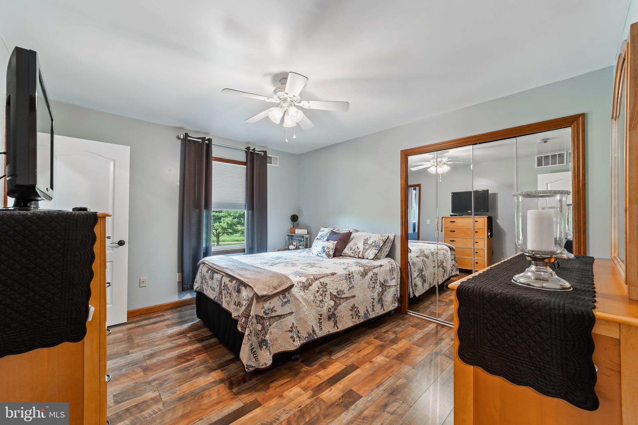 261 Red Lion Road Southampton, NJ 08088 - Photo 27 of 39 a bedroom with a bed and wooden floor