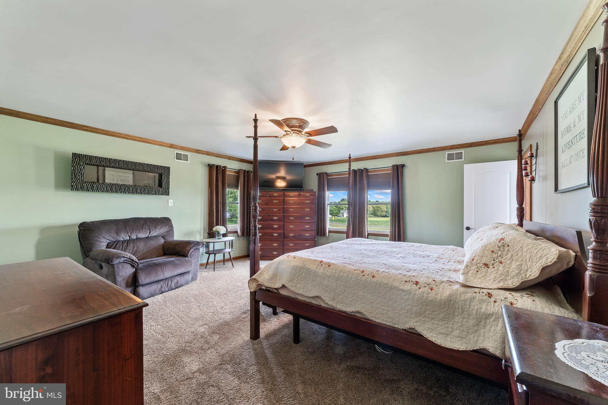 261 Red Lion Road Southampton, NJ 08088 - Photo 29 of 39 a bedroom with a bed and large windows