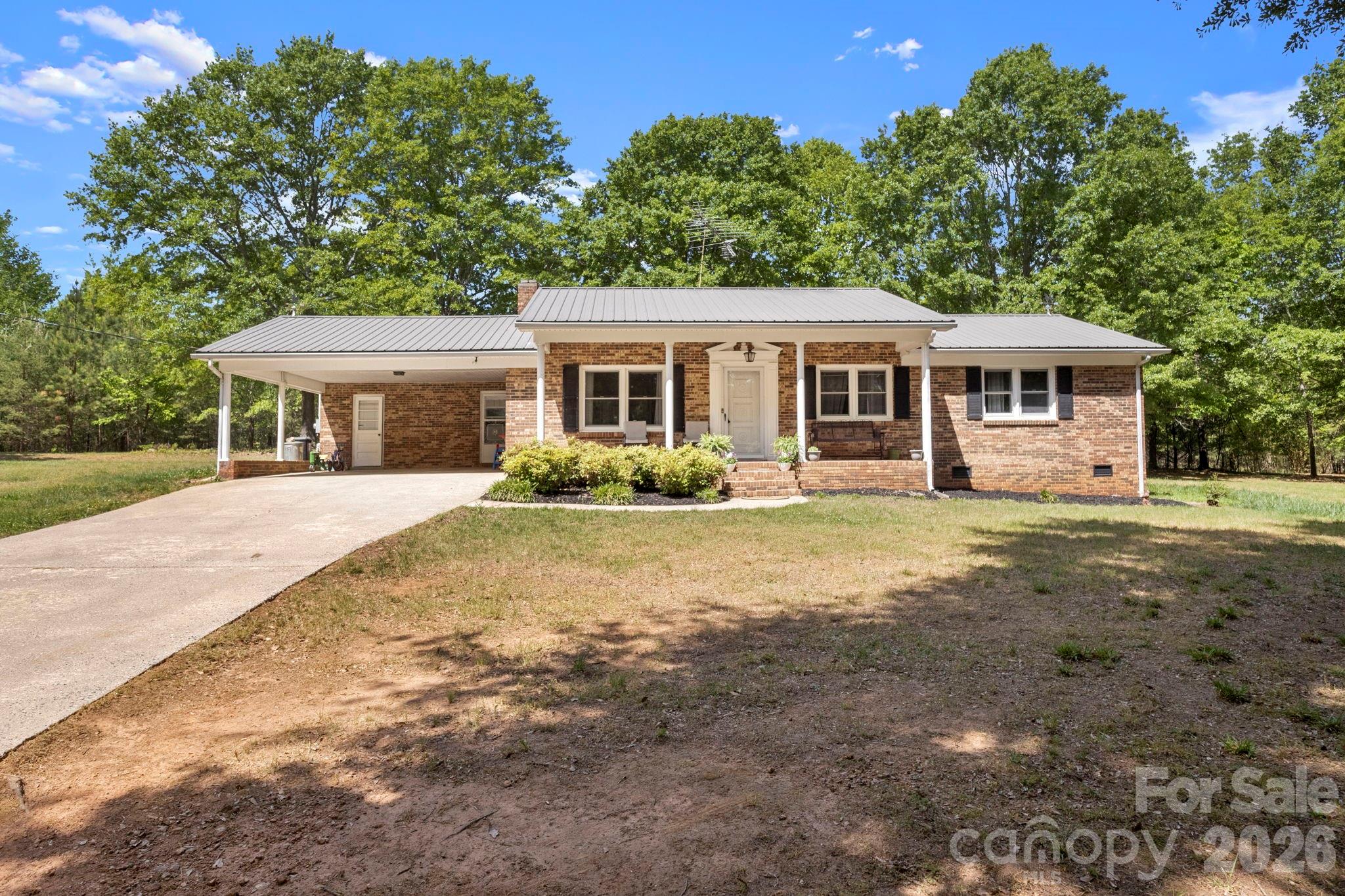 2200 Gaffney Road Shelby, NC 28152 - Photo 1 of 46 a front view of a house with a garden