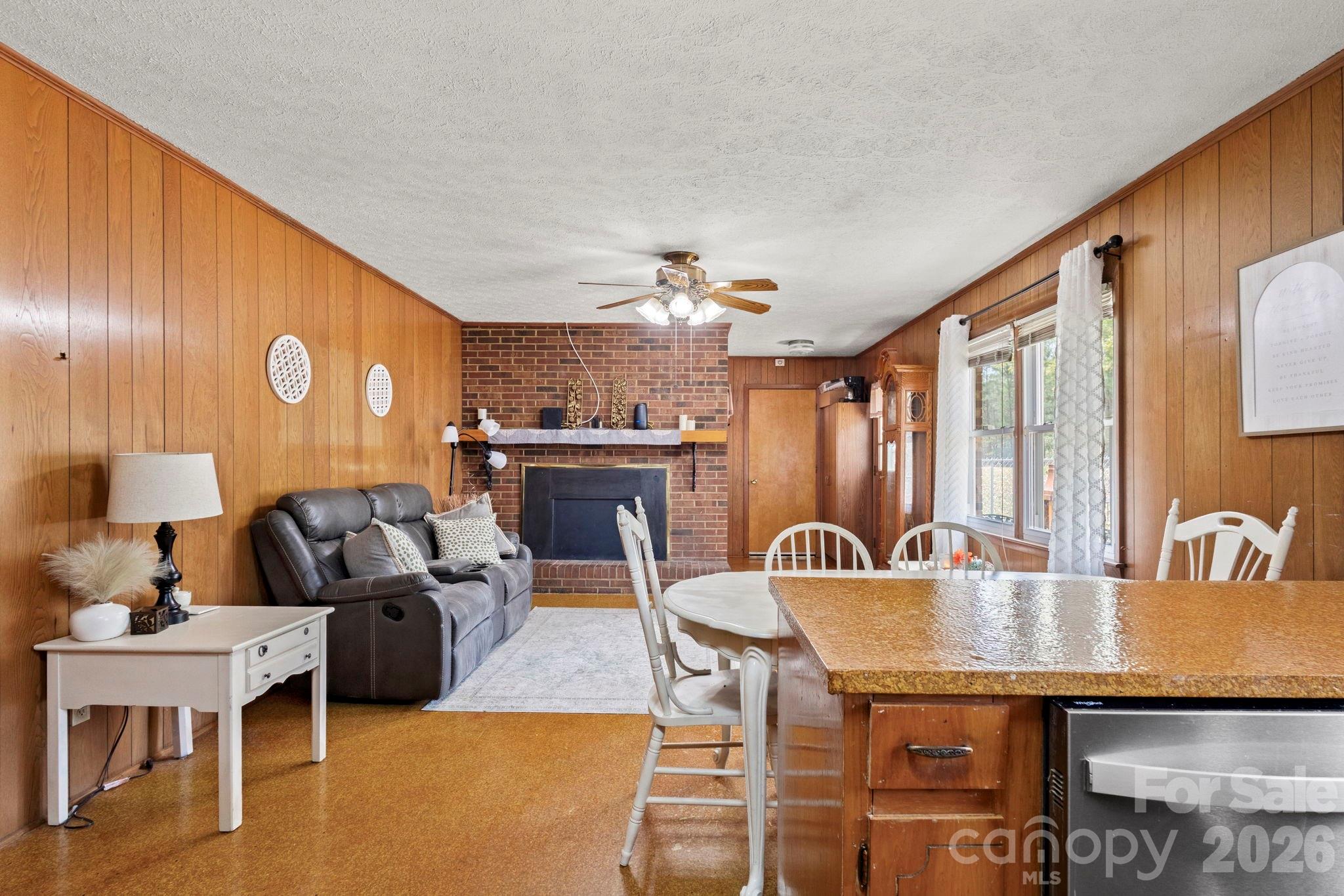 2200 Gaffney Road Shelby, NC 28152 - Photo 17 of 46 a living room with furniture and a chandelier