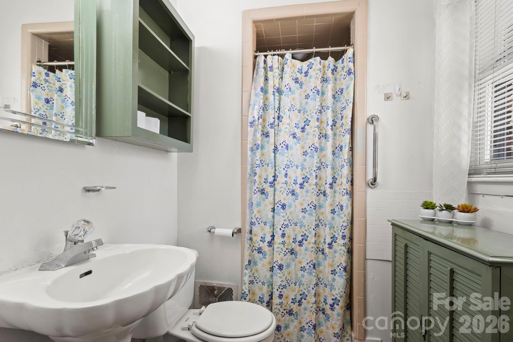 2200 Gaffney Road Shelby, NC 28152 - Photo 19 of 46 a bathroom with a sink toilet and shower