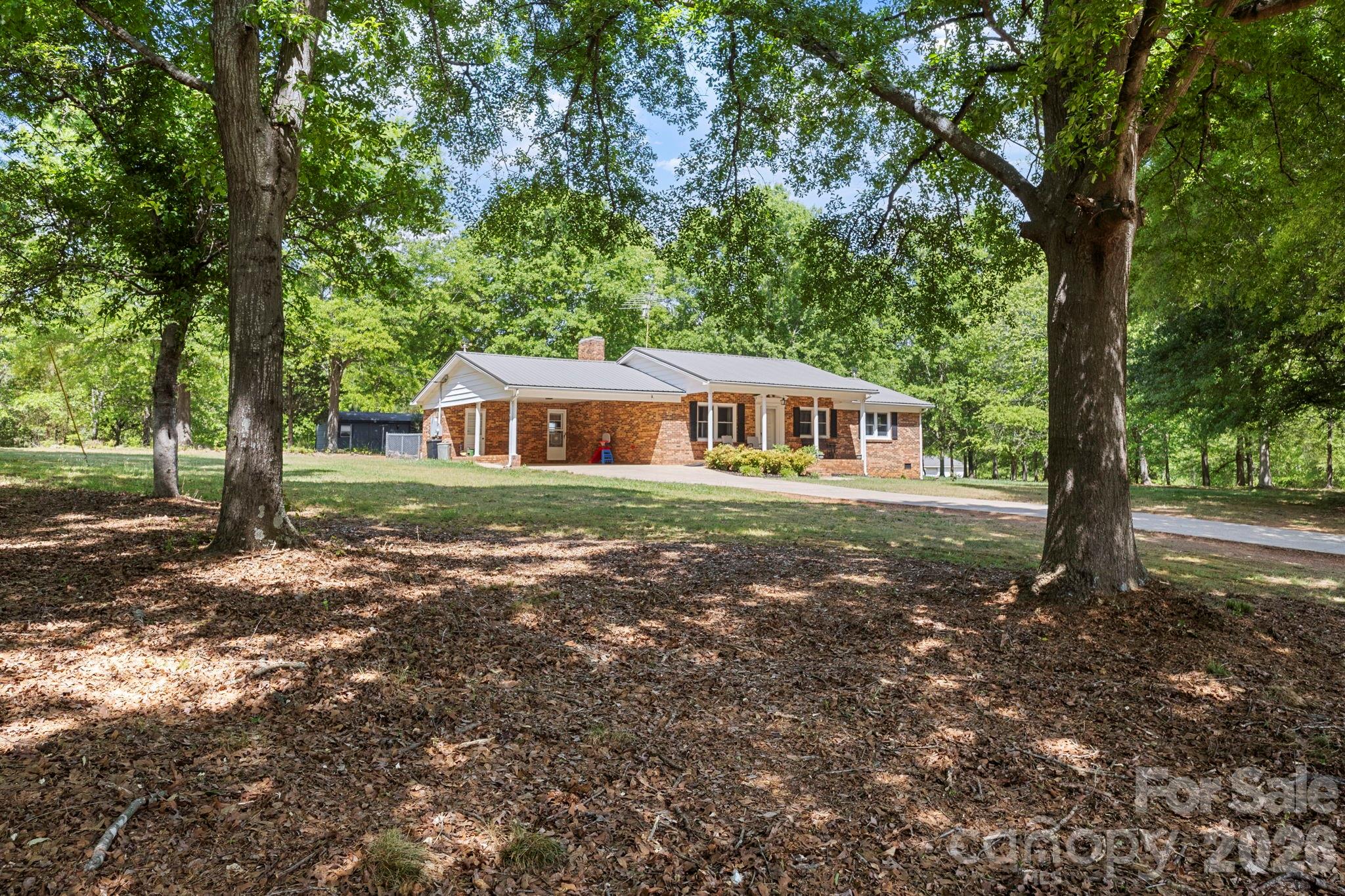 2200 Gaffney Road Shelby, NC 28152 - Photo 2 of 46 a house with trees in the background