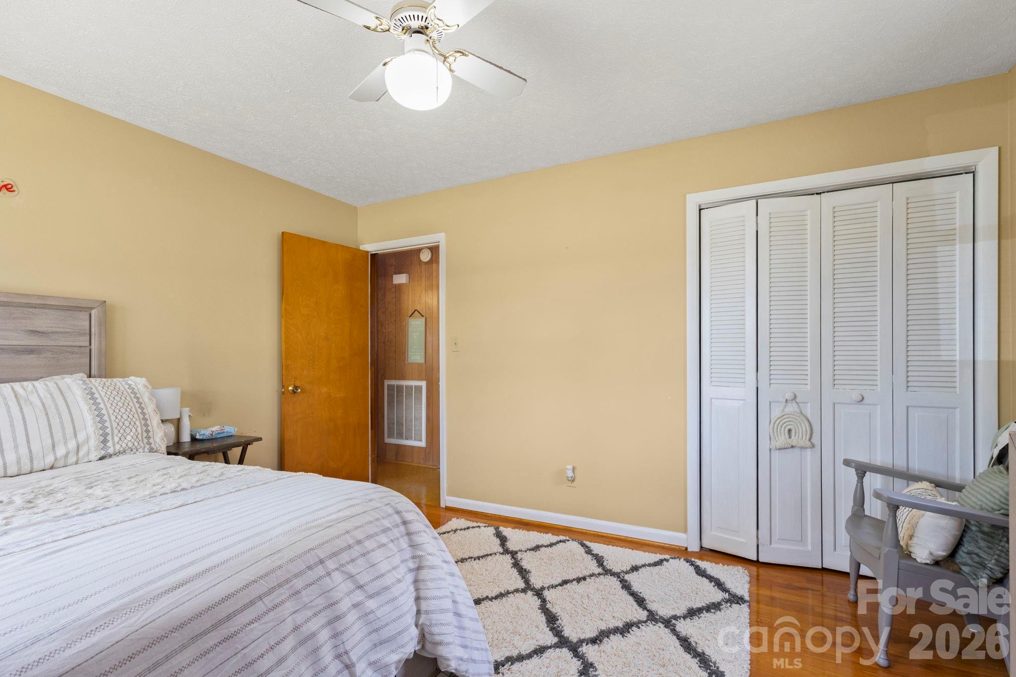 2200 Gaffney Road Shelby, NC 28152 - Photo 21 of 46 a bedroom with a bed and a chandelier
