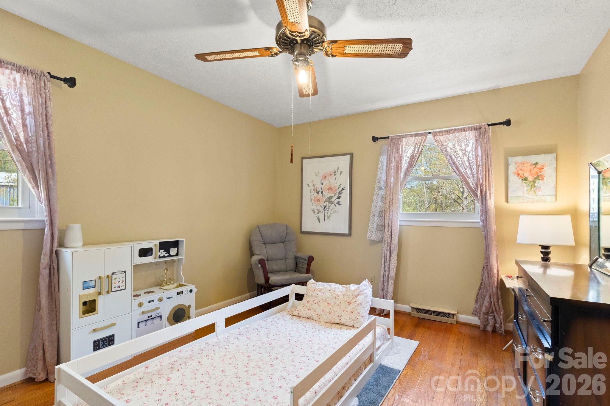 2200 Gaffney Road Shelby, NC 28152 - Photo 22 of 46 a bed room with a bed and a chandelier