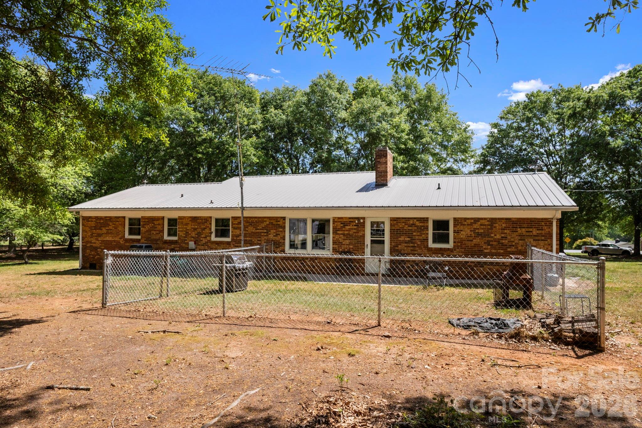 2200 Gaffney Road Shelby, NC 28152 - Photo 26 of 46 a view of a house with a yard chairs and a table