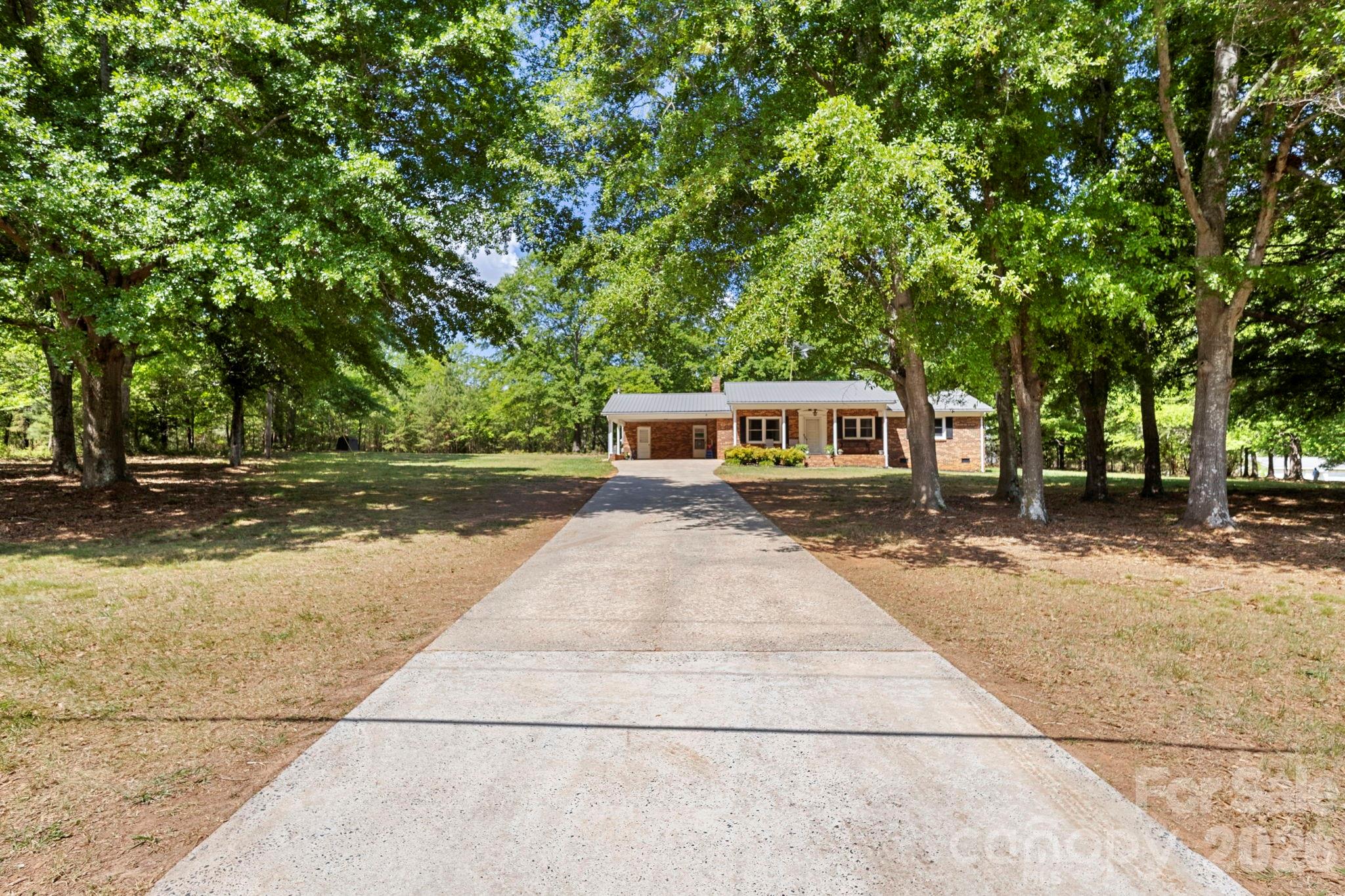 2200 Gaffney Road Shelby, NC 28152 - Photo 3 of 46 a front view of a house with a yard