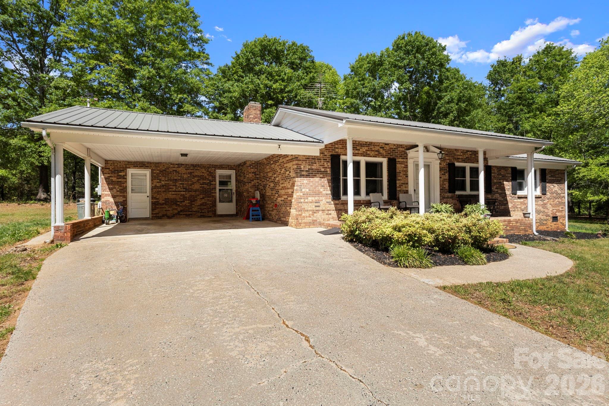 2200 Gaffney Road Shelby, NC 28152 - Photo 6 of 46 front view of a house with a yard