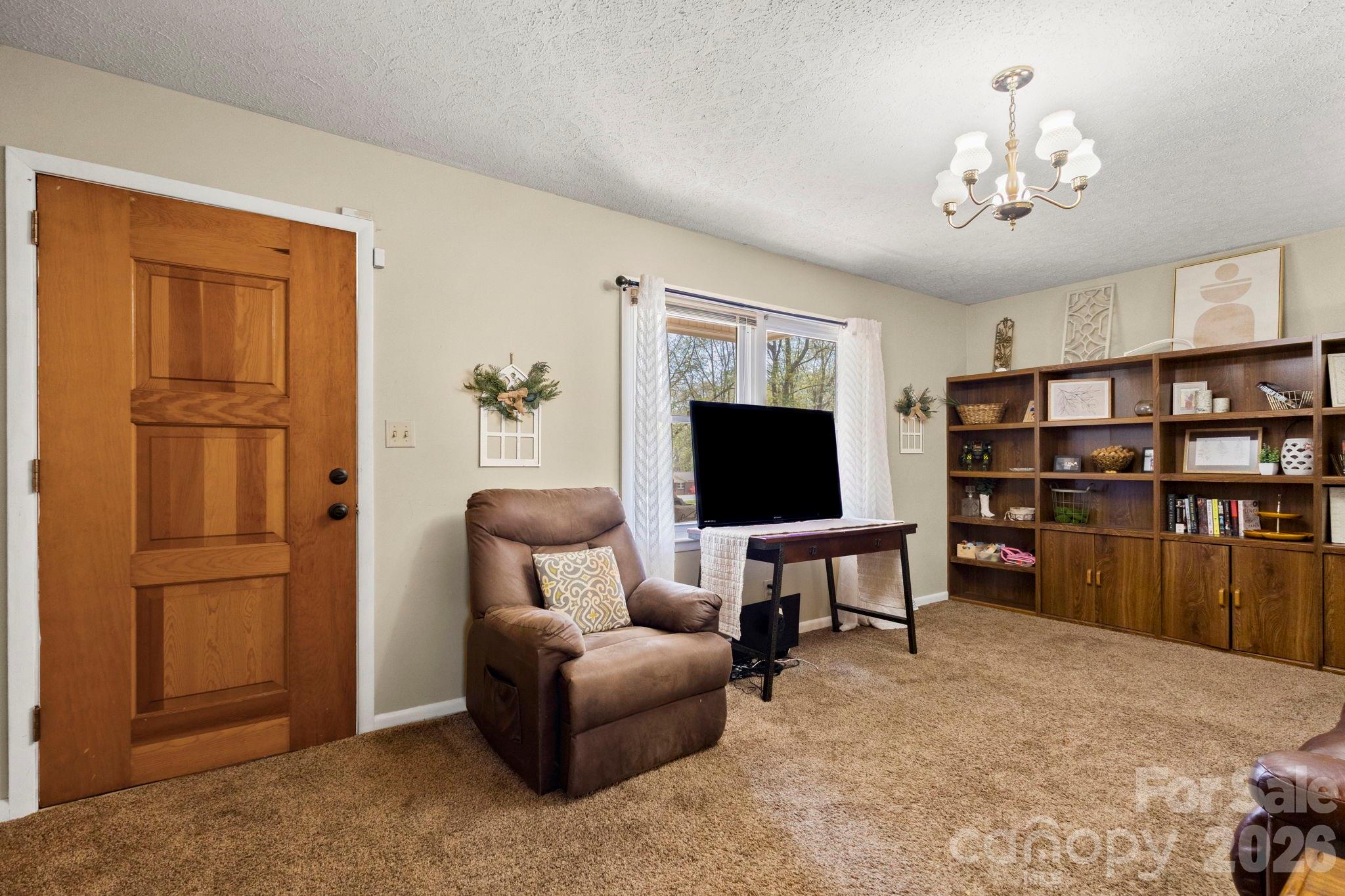 2200 Gaffney Road Shelby, NC 28152 - Photo 10 of 46 a living room with furniture and a flat screen tv