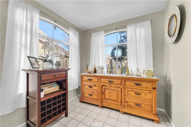 a kitchen with white cabinets and appliances