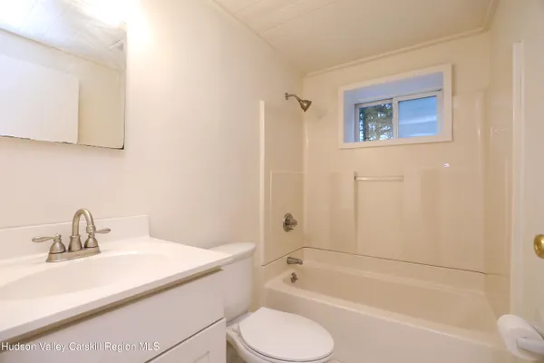 a bathroom with a sink toilet and bathtub
