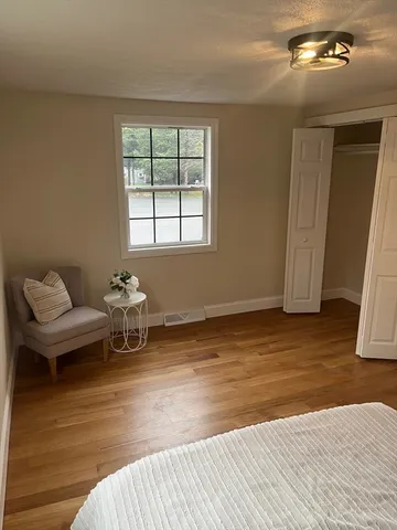 a view of a livingroom with furniture and window