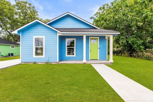 a front view of a house with yard