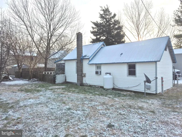 a house view with a backyard space
