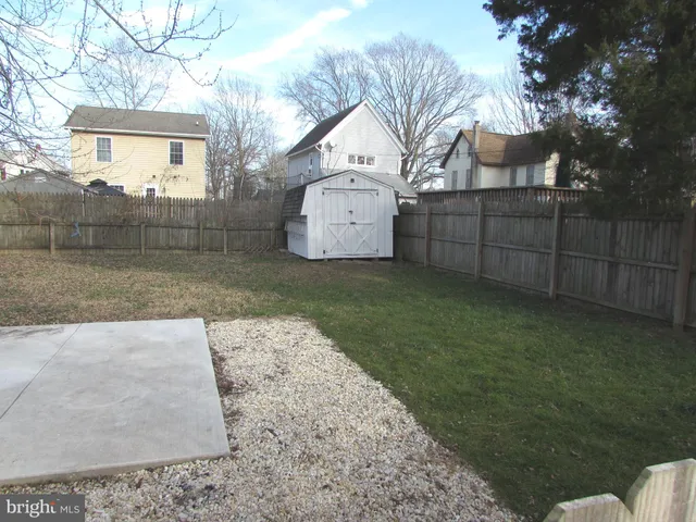 a kitchen with a refrigerator and a sink